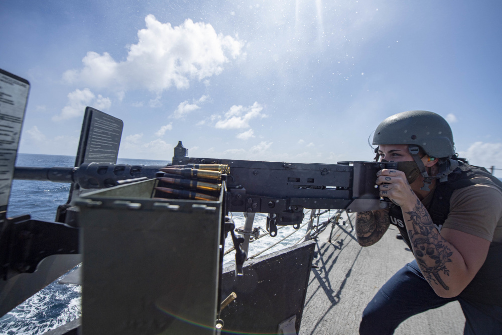 The Woodlands Sailor fires machine gun during live-fire exercise aboard U.S. Navy warship