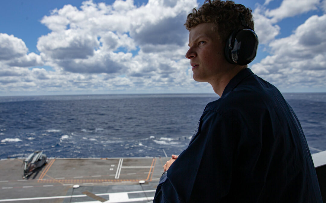 Quartermaster Seaman Zachery Teetz, from Montgomery, Texas, observes flight operations aboard the ship